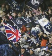 2005 Rd 15 - A Union Jack flag in the cheersquad a week after the London bombings.