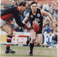 1989 Rd 20 - Fraser Murphy in his 100th game pressures ex Blue Ken Sheldon.Pic: Football Life.