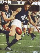 1970 GF - David McKay gets a rushed kick away.Pic: The Mighty Blues (Team of the Century).