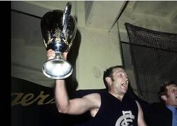 1970 Grand Final - John Nicholls holds the premiership cup in the rooms.