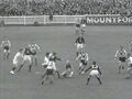 The Opening Bounce Of The 1945 Grand Final Carlton Vs SMAction from the first minute of the 1945 Grand Final. Carlton's Ron Savage takes possession on the ground, while Bert Deacon (no. 23) calls for a hand-pass.