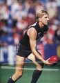1990 Rd 1 - David Rhys-Jones about to handball.Pic: Football Life.