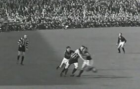 1938 GF Paul Schmidt Tackles Fred FroudeImage - VFL film.