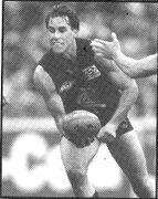 1995 GF - Matt Clape about to handball.Pic: Inside Football.